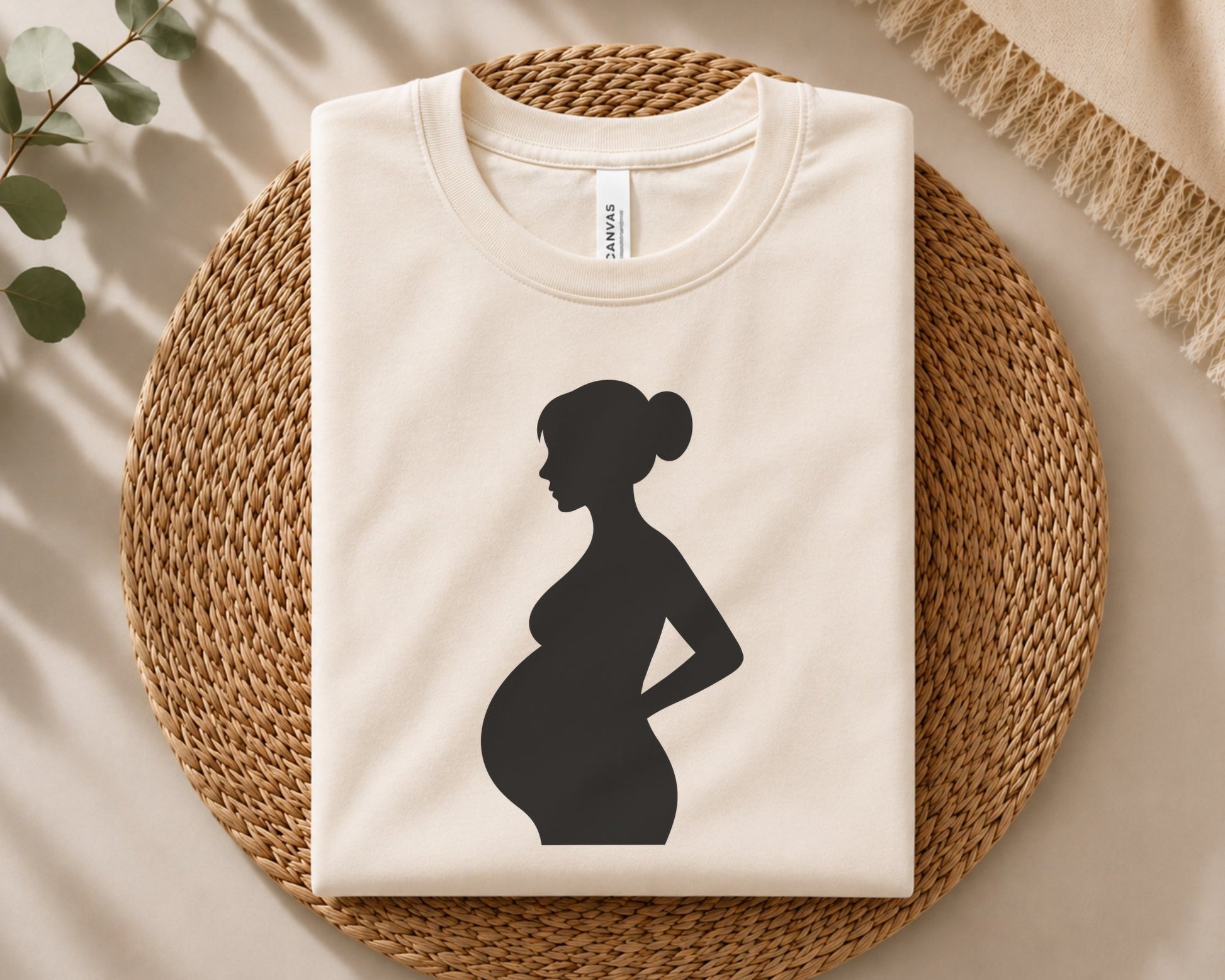 Minimalist side-view silhouette of an expectant mother with a large baby bump, smooth flowing contours and a clean solid black silhouette for craft projects.